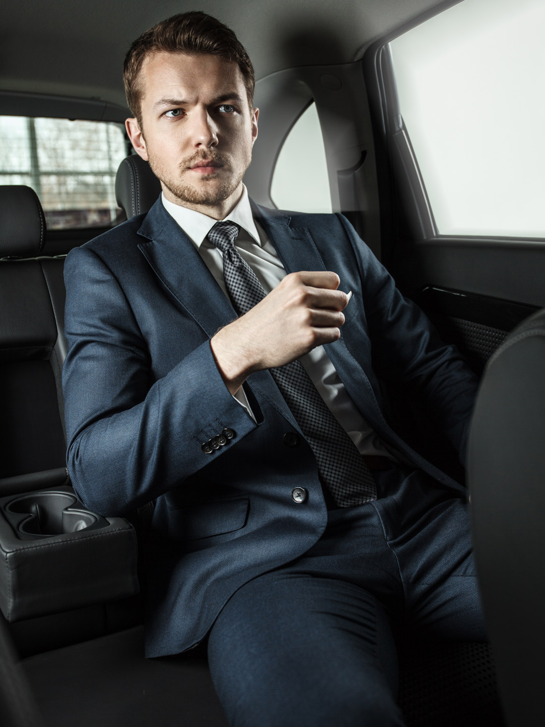 Businessman in the car | NYC Luxury Van Service